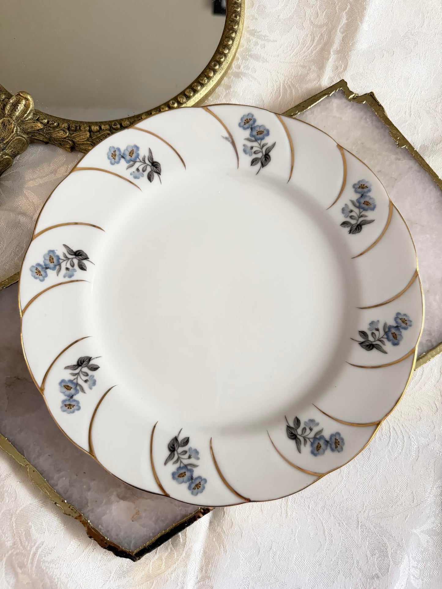Forget Me Not plate with gold mirror backdrop